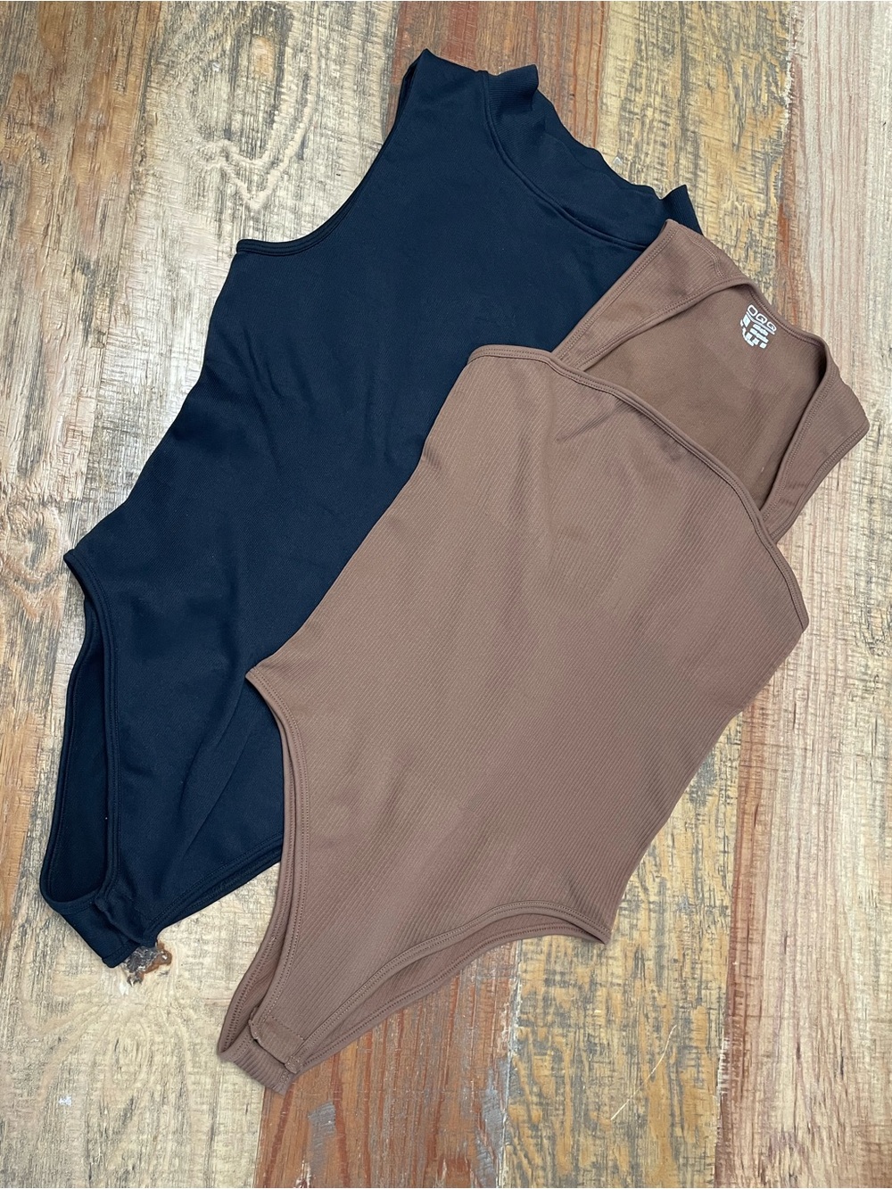 OQQ Body Suits- lot of 2. Black mock neck Brown square neck Large